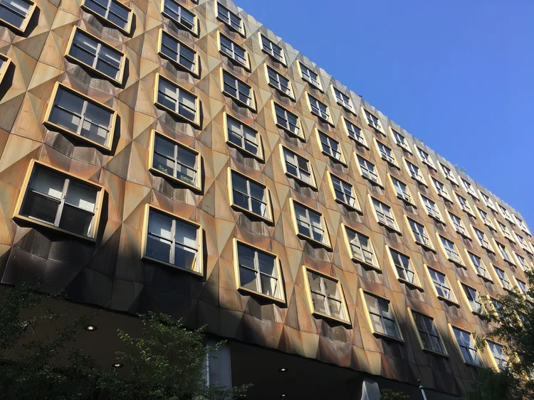  The newest addition, this 10-story structure features a multi-layered glass facade on West 28th Street, designed to open the campus to the city and allow passersby to see into labs and studios.
